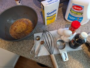 French toast batter with eggs, milk, sugar, cinnamon, and vanilla measured out